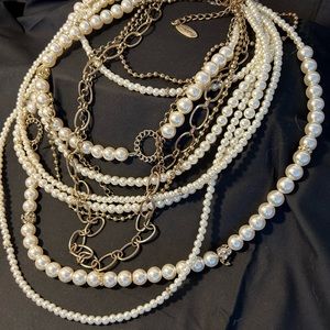 Chico pearl and gold necklace. It’s a statement piece. Hangs to 16”.